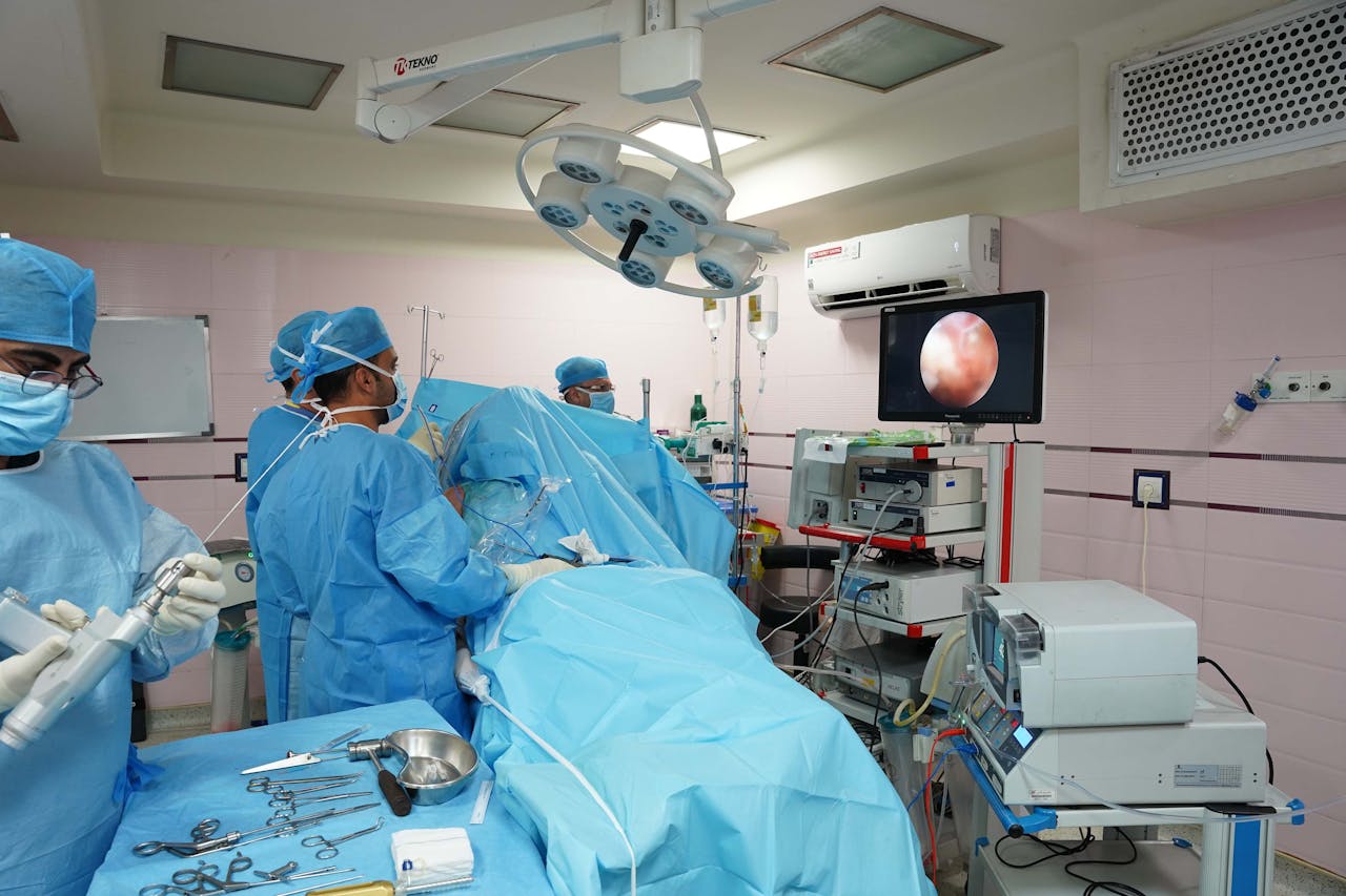 Mastering the First Impression: Your intriguing post title goes here Healthcare professionals in operating room conducting laparoscopic surgery with advanced medical equipment.
