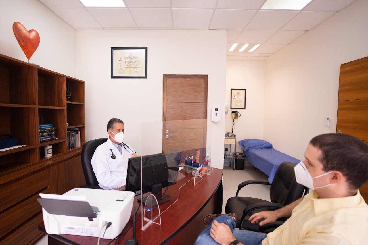 The Art of Drawing Readers In: Your attractive post title goes here Doctor and patient with masks in medical clinic, emphasizing healthcare safety.