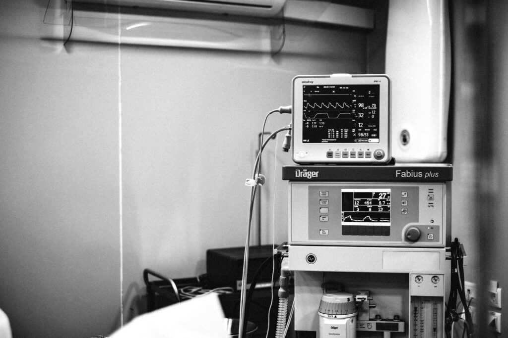 Black and white photo of a Fabius anesthesia workstation in a hospital environment.
